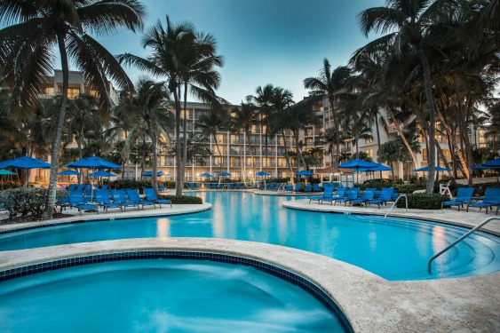 Best husband-wife golf vacation to Puerto Rico includes Relaxing by the pool after a round at the Wyndham Grand Rio Mar Puerto Rico Golf & Beach Resort.