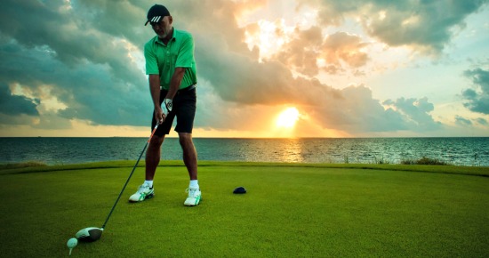 Playing at the Puerto Cancun golf course.